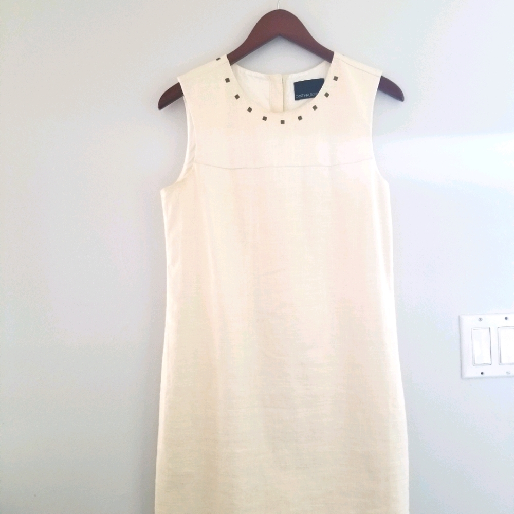 Sleeveless creme-colored dress with back detail